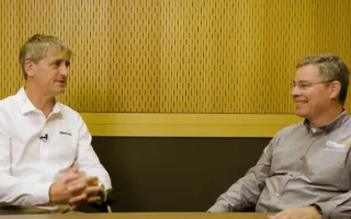 Lars Foged and Dermot O'Shea sitting at a table recording a Podcast